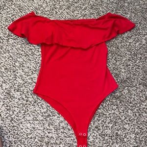 Red across the shoulder body suit